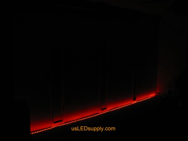 RGB LED strips light up a home theater area in an apartment.