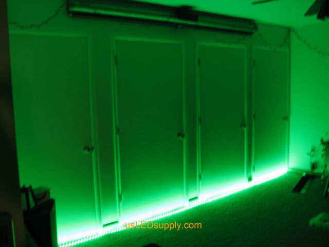RGB LED strips light up a home theater area in an apartment.