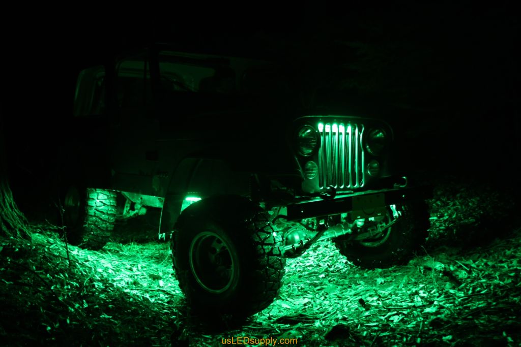 Green Jeep with Green flexible LED strips for undercar lighting effects.