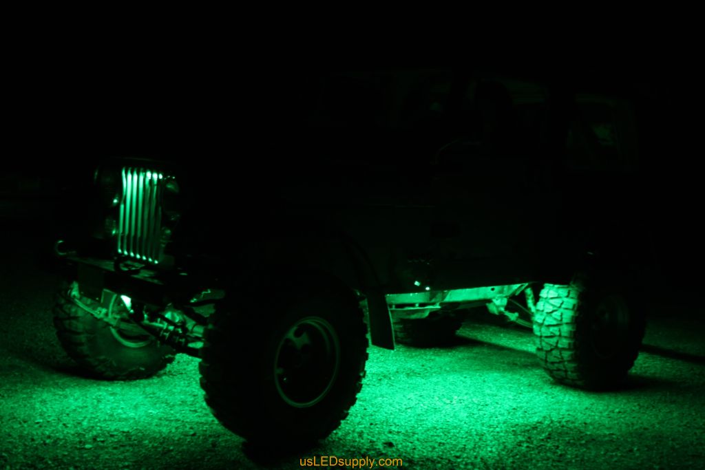 Green Jeep with Green flexible LED strips for undercar lighting effects.
