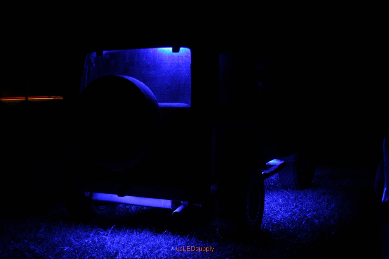 Blue Jeep with blue flexible LED strips for undercar lighting effects.