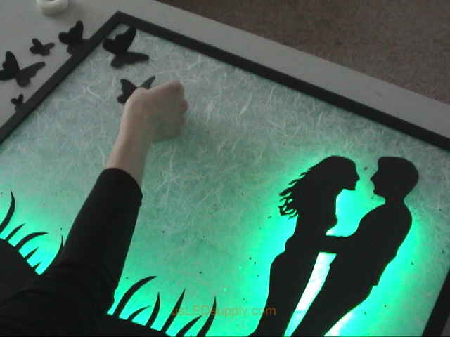 Attach additional silhouette pieces with glue dots or pop up relief adhesive.