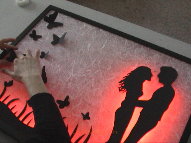 Attach additional silhouette pieces with glue dots or pop up relief adhesive.
