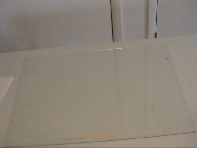 Lay glass out on a flat table.