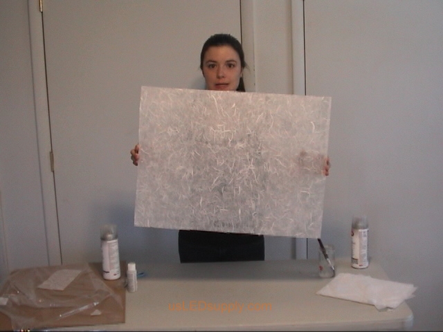 Transluscent mulberry paper is now covering the entire piece of glass.