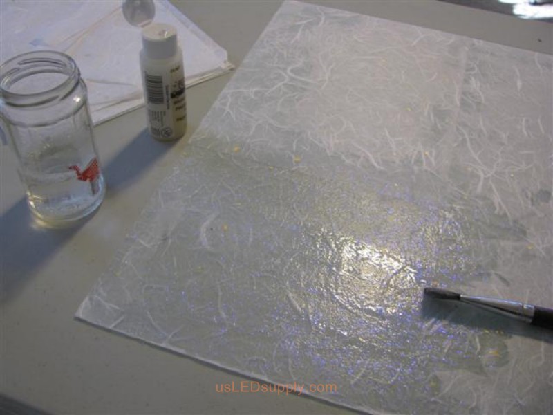 Cover the white paper with diamond glitter paint- this gives it a nice effect in the daytime (at night you don't notice this).