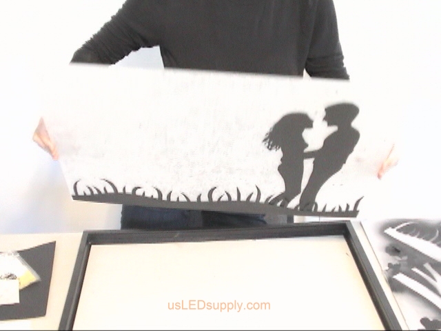 Put glass back in frame and set face down on the table.