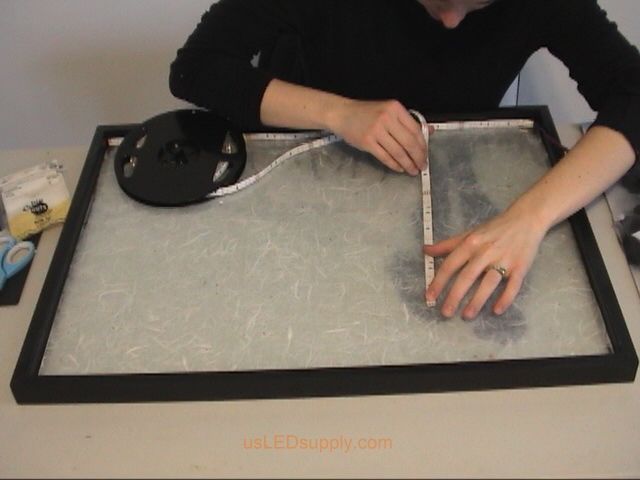 Cutting RGB Flexible LED Strip to light up silhouette art project.