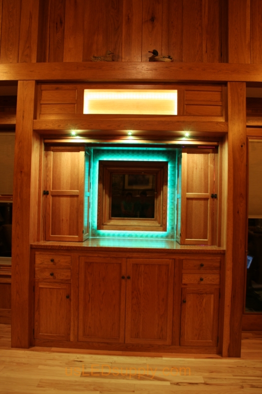 RGB LED Strips illuminate a window overlooking a lake. 
