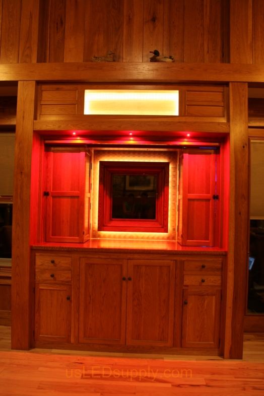 RGB LED Strips illuminate a window overlooking a lake.