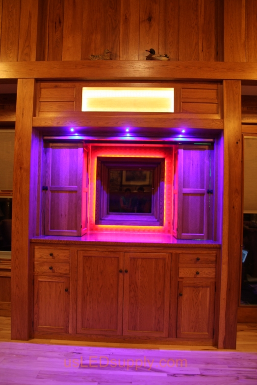 RGB LED Strips illuminate a window overlooking a lake.
