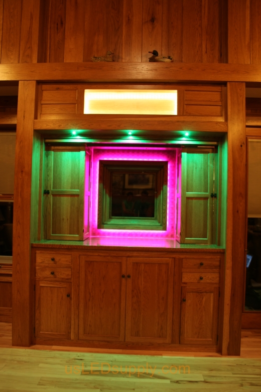 RGB LED Strips illuminate a window overlooking a lake.