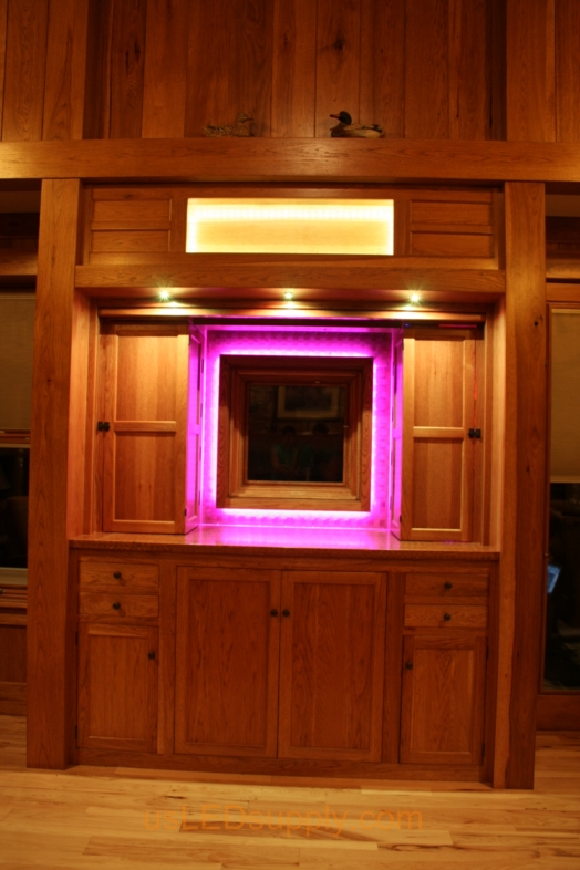 RGB LED Strips illuminate a window overlooking a lake.