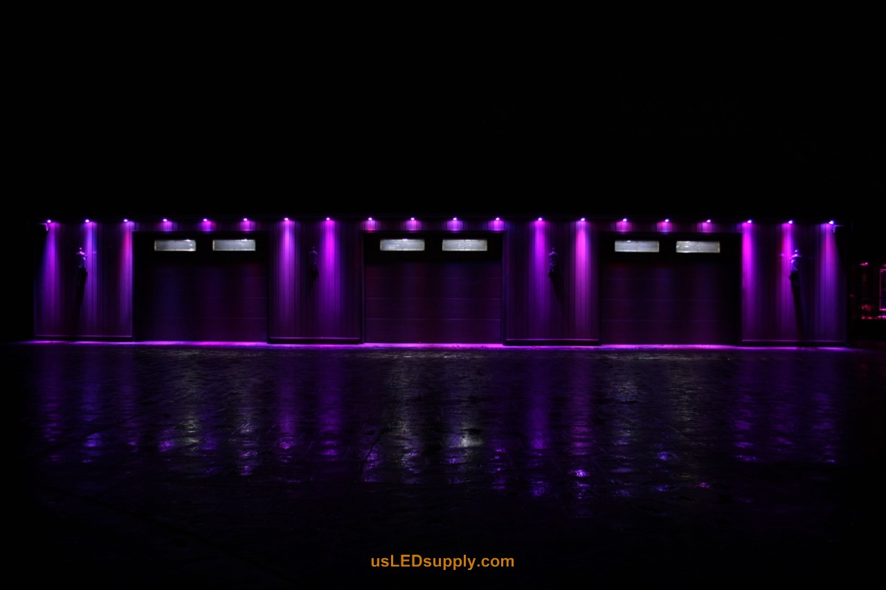 RGB Puck Lights outside of a garage set on purple color.
