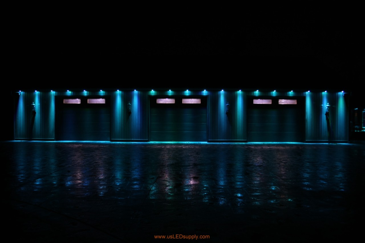 RGB Puck Lights outside of a garage set on light blue.