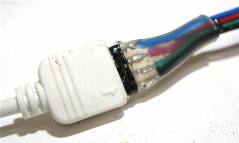 Hot glue and heat shrink tubing protect this solder connection between 4 pin connector and IR receiver