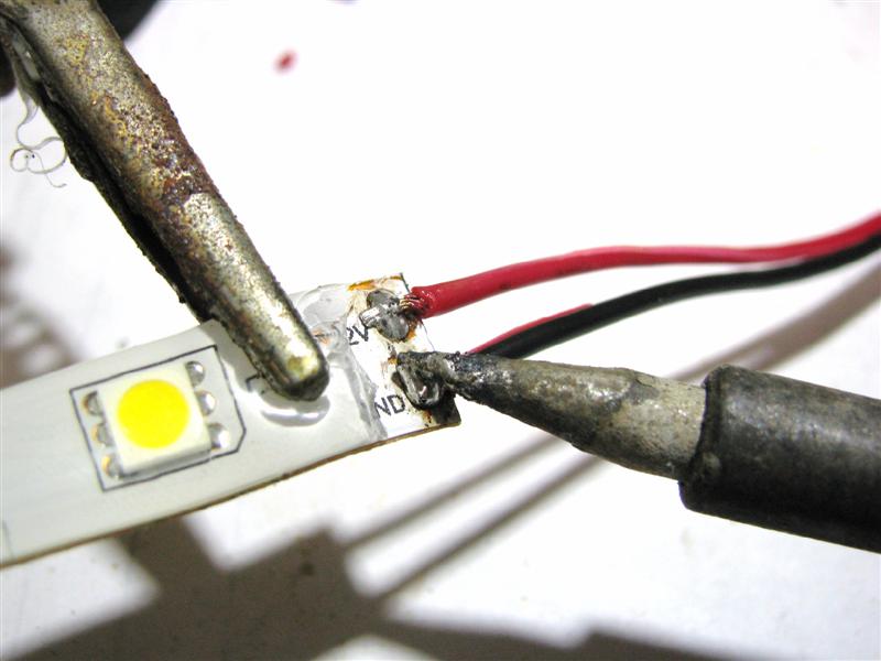 Solder two pre-tinned wires onto the solder pads of the first single color flexible LED strip