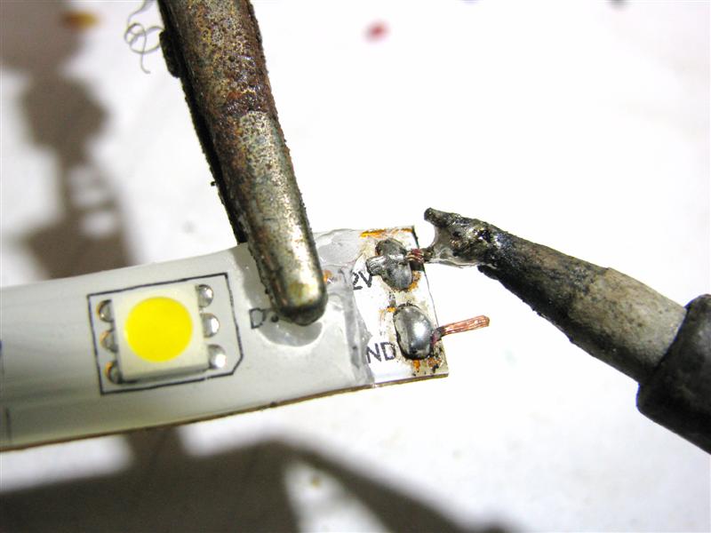 Pre tin wires attached to solder pads on first single color flexible LED strip.