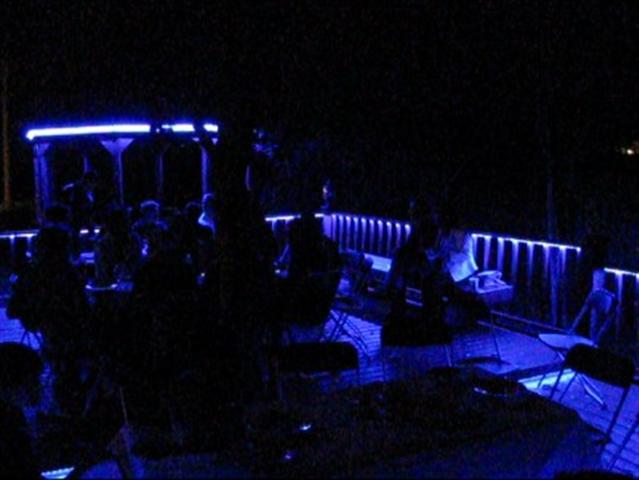 LED Deck lights on during an outdoor dinner party