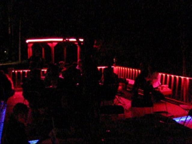 LED Deck lights on during an outdoor dinner party