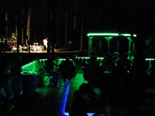 LED Deck lights on during an outdoor dinner party