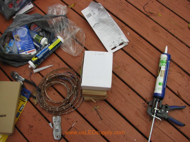 All of the materials laid out for deck lighting project.
