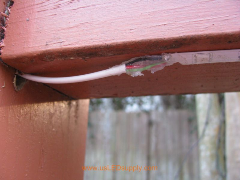Silicon is waterproofing this solder connection between control cable and flexible LED strip.
