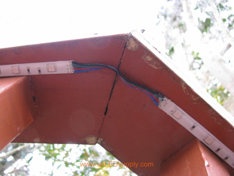 Connect Flexible LED strips around corners using small pieces of wire.