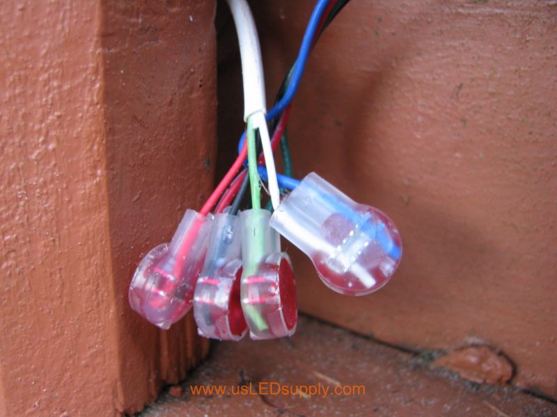 You can use 3M Scotchlok waterproof butt connectors to make waterproof connections between the control cable and wires on the end of the flexible LED strips.