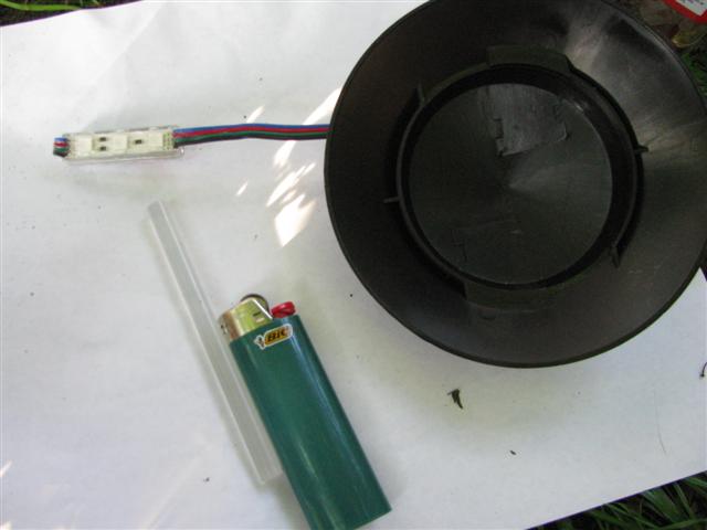 RGB LED module, garden path light cap, hot glue stick, lighter.