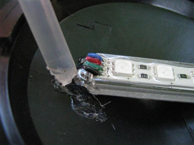 Attach the RGB LED module to the light cap with hot glue or some other type of adhesive.