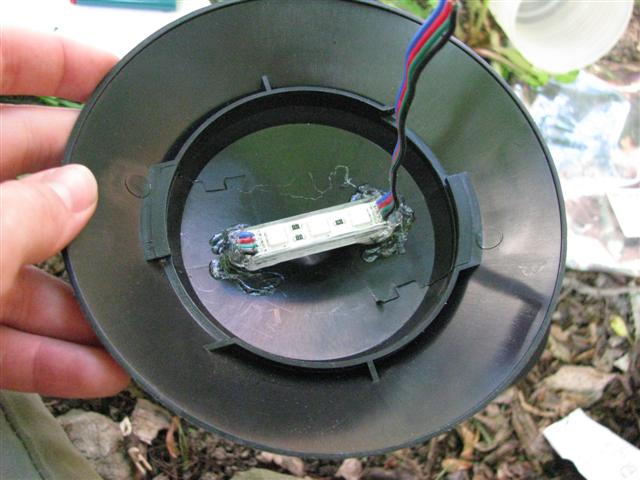 RGB LED module attached to the light cap with hot glue.