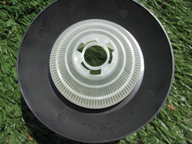 The bottom shade on the garden light.