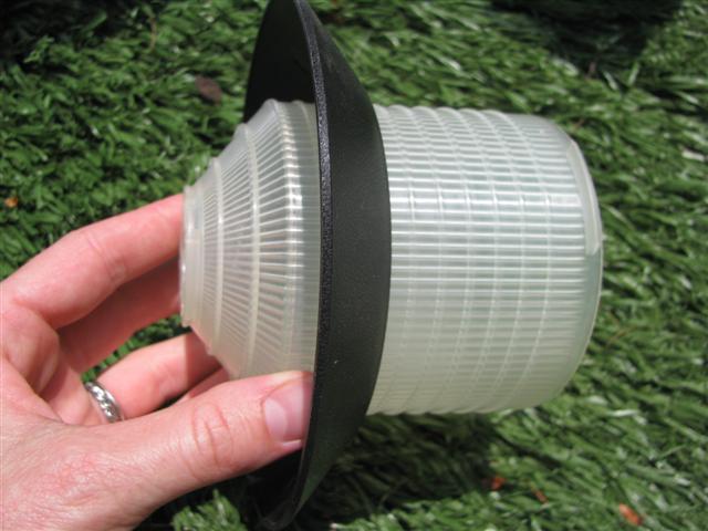 Clear garden light shade with bottom trim put on.