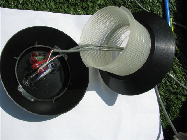 Now you will simply pull the excess control wire through the bottom and snap the lid in place.