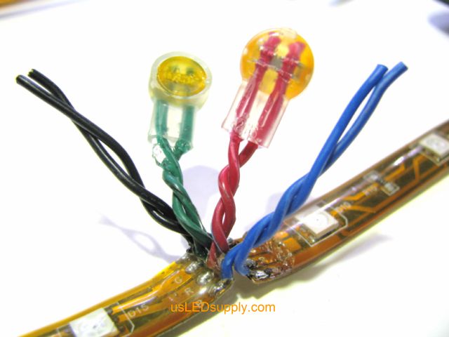 Butt crimp connectors connecting the wires between two RGB flexible LED strips