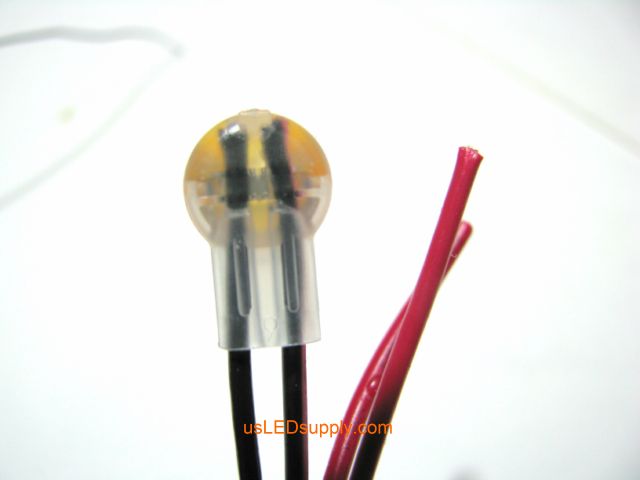 Insert both black wires the entire way into the butt connector.