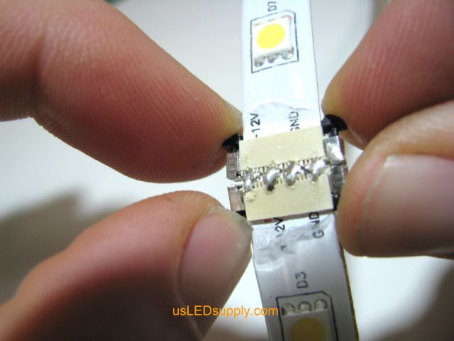 Push black piece of splice connector in to make connection