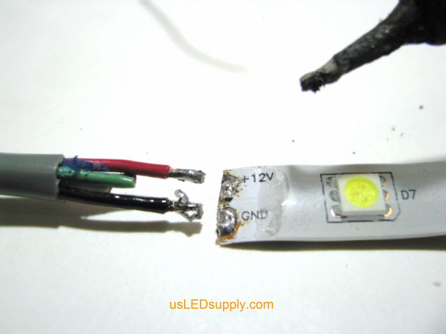 Match up the wires with the solder pads, red for positive and black for negative.