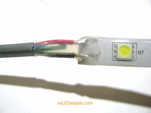 Cover solder connection with heat shrink tubing
